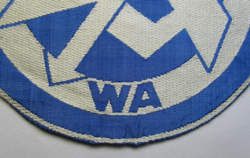 Attractive - and scarcely encountered! - SA (ie. 'Sturmabteilungen'), 'BeVo'-woven sport-shirt insignia still showing its period-attached 'RzM'-etiket as was intended for an SA-member who served within the: 'Gruppe Wartheland' (WA)