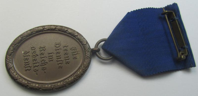 RAD (ie. 'Reichsarbeitsdienst'): 'Dienstauszeichnung 4. Stufe für Männer' as was intended for 4 years loyal-service and that comes mounted onto its period (broad-sized) ribbon (ie. 'Bandabschnitt')