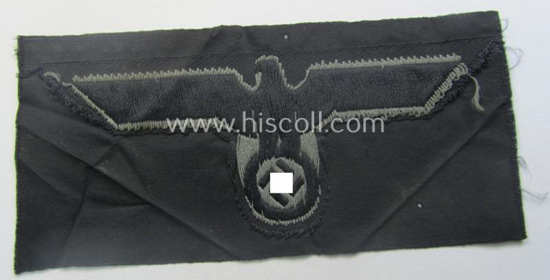 Later- (ie. mid-war-) period, WH (Heeres) 'Panzer'-type breast-eagle (ie. 'Brustadler für Panzertruppen') being a 'virtually mint- ie. unissued' example as executed in bluish-grey-coloured linnen on a black-coloured background