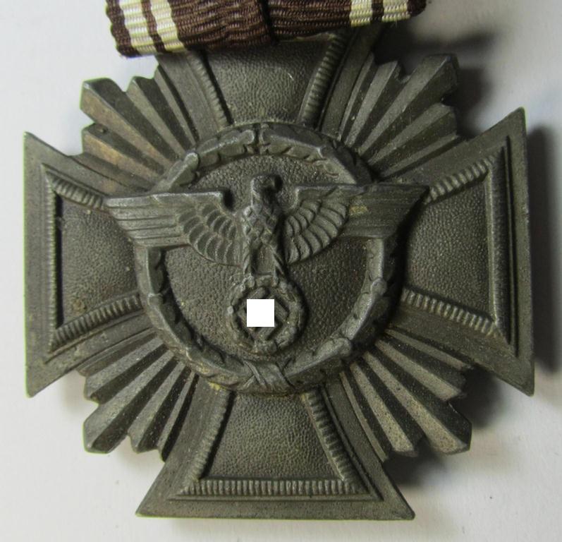 Attractive - and not that easily found! - 'N.S.D.A.P. Dienstauszeichnung in Bronze' (ie. '3. Stufe für 10 Jahre t.D.') being a 'thinner-shaped'-pattern, zinc- (ie. 'Feinzink'-) based example that comes mounted onto a so-called: 'Einzelspange...