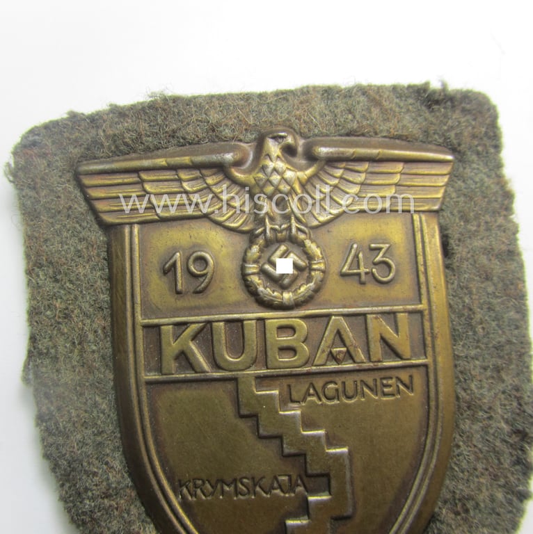Attractive - truly worn and actually scarcely encountered! - WH (Heeres ie. Waffen-SS) 'Kuban'-campaign-shield that comes mounted onto its original field-grey-coloured- and/or woolen-based 'backing' as issued and/or used