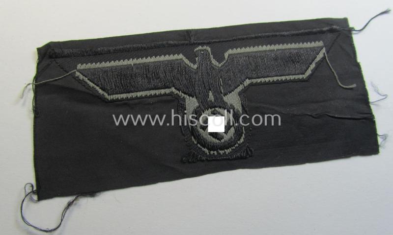 Later- (ie. mid-war-) period, WH (Heeres) 'Panzer'-type breast-eagle (ie. 'Brustadler für Panzertruppen') being a 'virtually mint- ie. unissued' example as executed in bluish-grey-coloured linnen on a black-coloured background