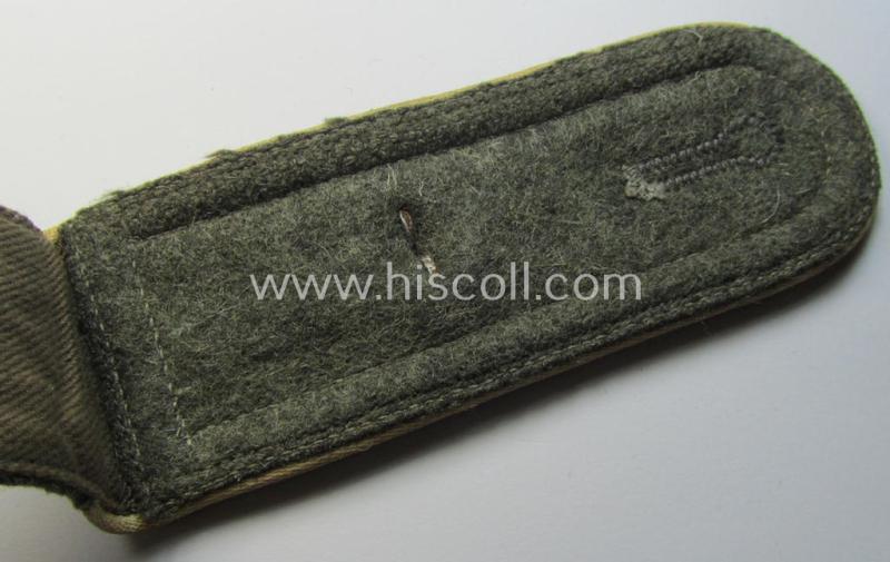 Single, WH (Heeres) NCO-type (ie. 'M40'- ie. 'M43'-pattern) shoulderstrap having the white-coloured branchcolour as was intended for - and clearly worn by! - a: 'Feldwebel der Infanterie-Truppen'