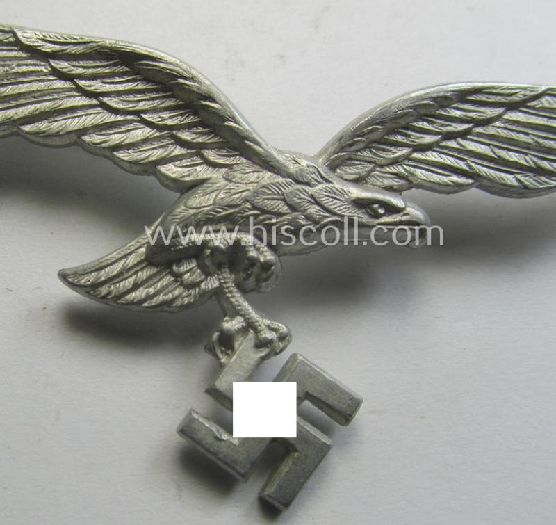 Minimally worn, WH (Luftwaffe) EM/NCO-pattern visor- (ie. 'Schirmmützen'-) cap-eagle being clearly maker- (ie. 'F.Sch.L.'-) marked example as executed in aluminium-based metal