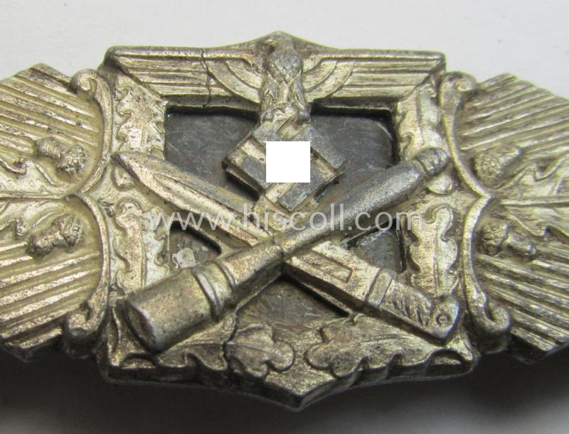 Super - albeit damaged! - 'Nahkampfspange in Silber' (or: silver-class close-combat clasp ie. CCC) being a neatly maker-marked- and/or non-converse-shaped specimen as was produced by the: 'C.F. Juncker'-company