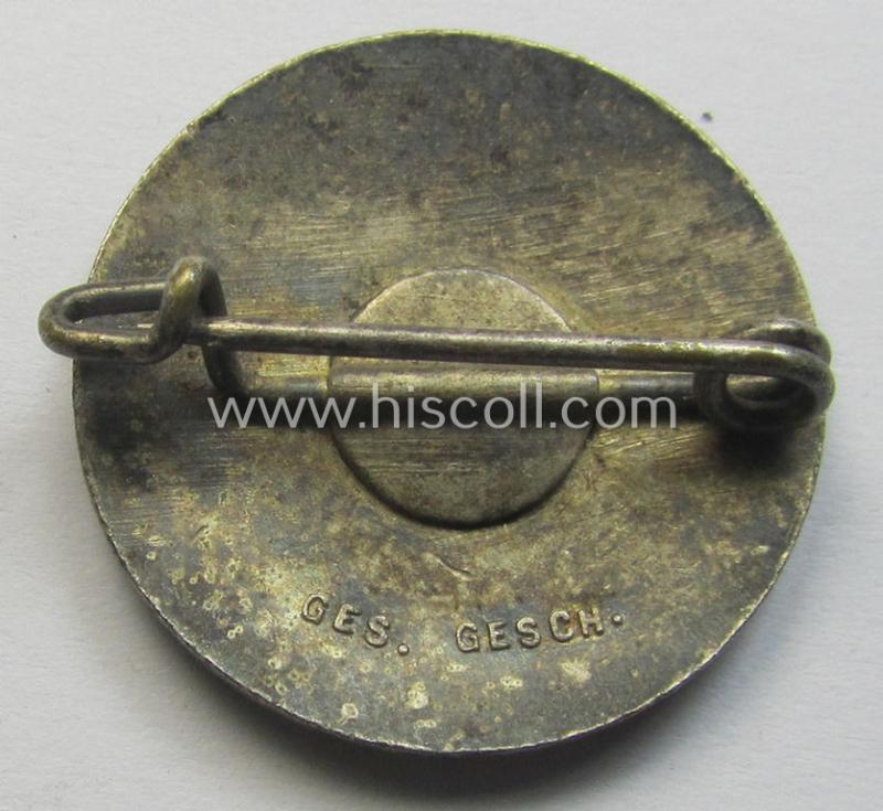 Attractive - darker-red-coloured and very nicely preserved! - 'variant'-pattern 'N.S.D.A.P.'-supporter-pin- ie. party-badge (or: 'Parteiabzeichen') being a regular-sized specimen that shows a 'Ges.Gesch.'-patent-pending-designation