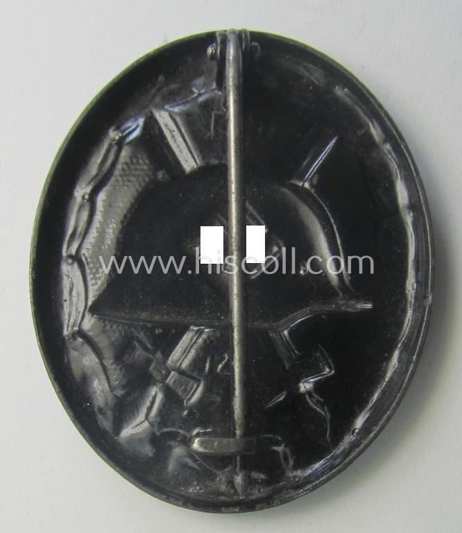 Dual-maker- (ie. 'E.H.'- and/or: '126'-) marked example of a black-class wound-badge (or: 'Verwundeten-Abzeichen in Schwarz') being an example that was produced by the maker (ie. 'Hersteller') named: 'Eduard Hahn'