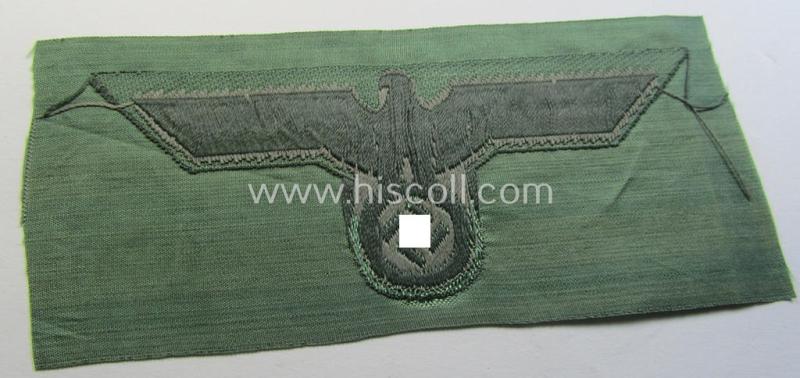 WH (Heeres) mid-war-period- and/or greyish-coloured breast-eagle of the so-called: 'M41'- (ie. 'M43'-) pattern 'Brustadler für Mannschaften u. Unteroffiziere') as executed in the neat 'BeVo'-weave pattern on a field-grey-coloured background