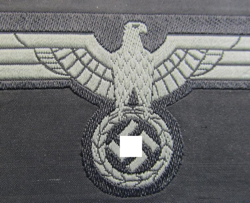 Later- (ie. mid-war-) period, WH (Heeres) 'Panzer'-type breast-eagle (ie. 'Brustadler für Panzertruppen') being a 'virtually mint- ie. unissued' example as executed in bluish-grey-coloured linnen on a black-coloured background