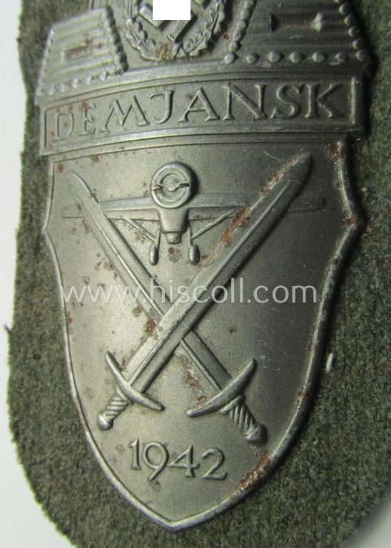 Superb example of a - fairly scarcely encountered! - WH (Heeres ie. Waffen-SS) 'Demjansk'-campaign-shield as executed in typical magnetic metal (ie. so-called: 'Eisenblech') and that comes in an overall very nice- ie. fully untouched, condition