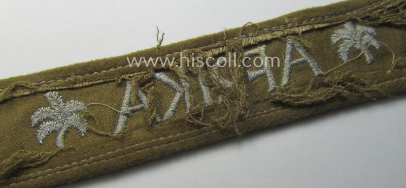 WH (LW o. Heeres) cuff-title (ie. 'Ärmelstreifen') entitled: 'Afrika' (being an example that comes in a presumably issued- albeit simply never used- ie. 'virtually mint' condition)
