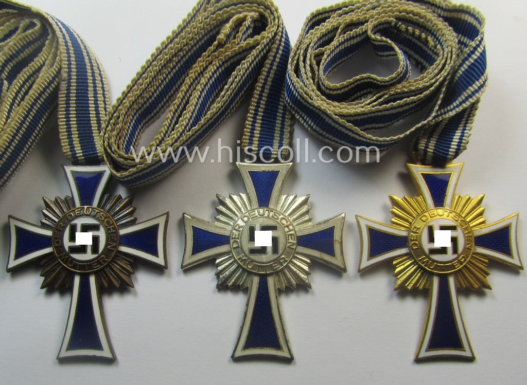3-pieced grouping comprising of all 3 classes of the: 'Ehrenkreuz der Deutschen Mutter' (ie. bronze-, silver- and/or gold class mothers'-crosses) being all three issued- ie. worn examples