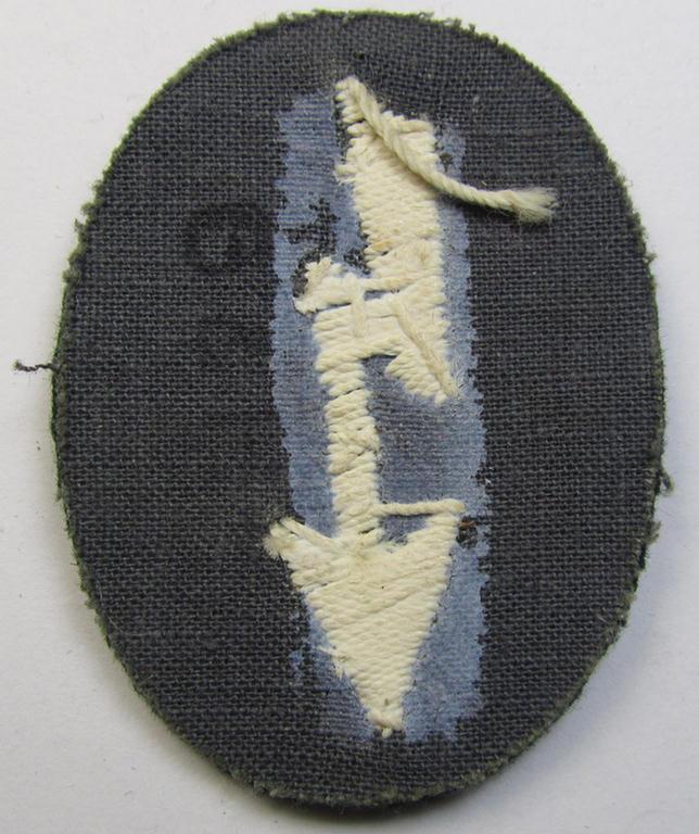 Clearly tunic-removed WH (Heeres) trade- and/or special career insignia ie. hand-embroidered signal-blitz (being a neatly maker-marked example as executed in white) as was intended for a soldier serving within the: 'Infanterie-Truppen'