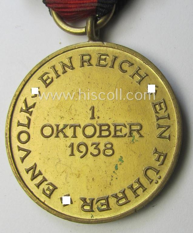 WH Czech-occupation- (ie. 'Anschluss'-) medal: '1. Oktober 1938' being a neat (albeit minimally tarnished) example that comes mounted onto its period ribbon and that shows a firmly (and period!) attached 'Prager Burg-Spange'