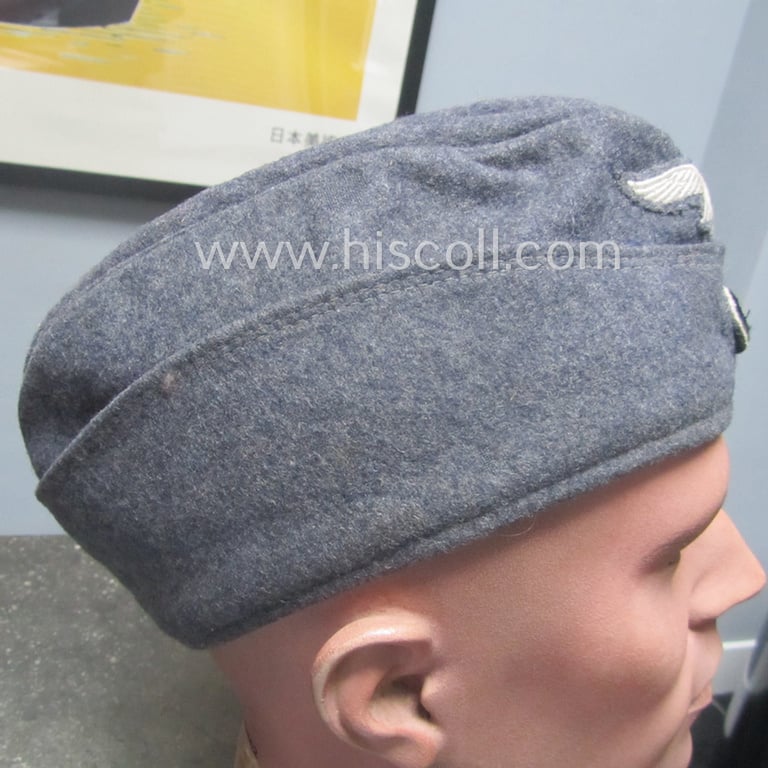 Attractive - albeit moderately used- ie. worn - WH (Luftwaffe) bluish-grey-coloured, EM- (ie. NCO-) type side-cap (ie. 'Schiffchenmütze für Mannschaften u. Unteroffiziere der Luftwaffe')