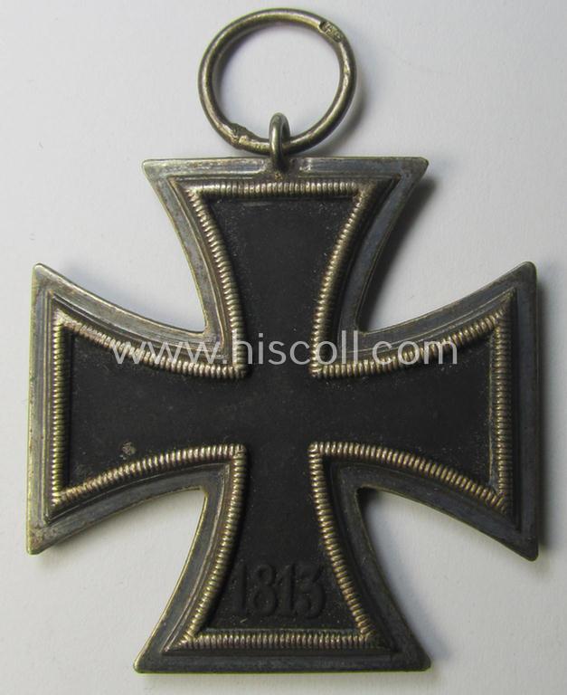 'Eisernes Kreuz II. Klasse' being a maker- (ie. '44'-) marked example that comes together with its (mint- and full length) ribbon (ie. 'Bandabschnitt') as was produced by the maker (ie. 'Hersteller'): 'Jakob Bengel - Oberstein'
