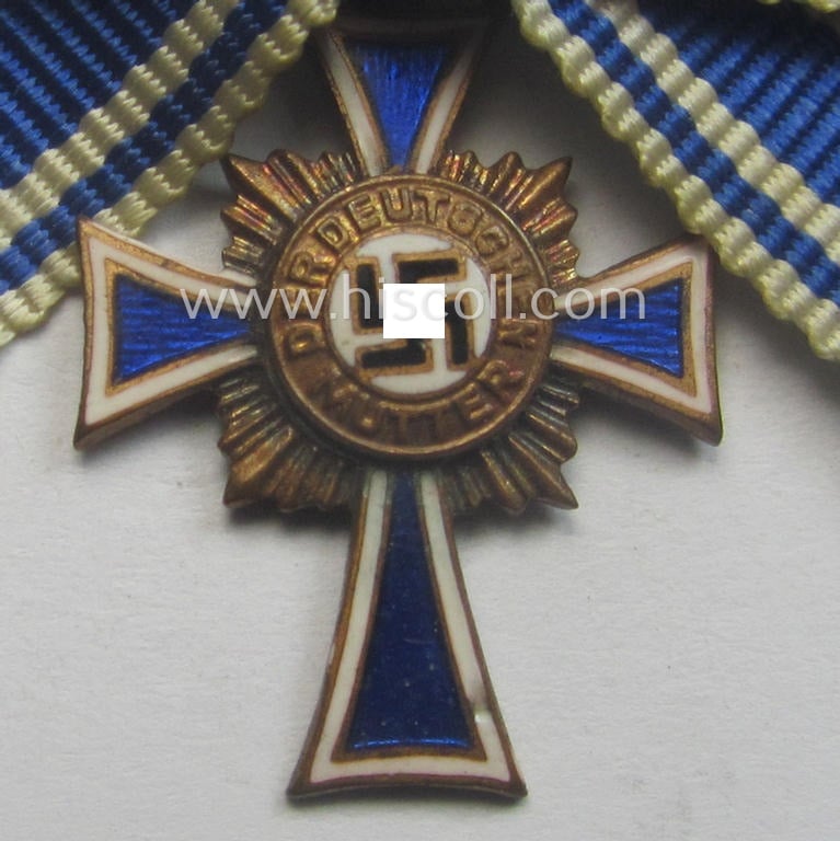Miniature of an: 'Ehrenkreuz der deutschen Mutter - dritte Stufe' (or: bronze-class mothers'-cross) being a maker- (ie. 'L/11'-) marked example