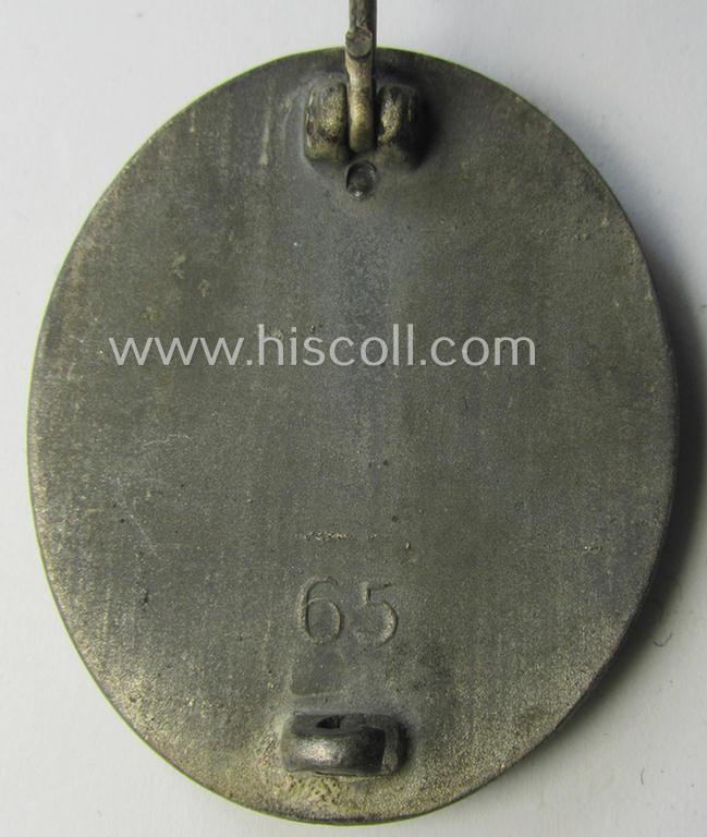 Attractive - and moderately used- and worn! - example of a maker- (ie. '65'-) marked example of a silver-class wound-badge (or: 'Verwundeten-Abzeichen in Silber') as was produced by the 'Hersteller' ie. maker: 'Klein u. Quenzer'