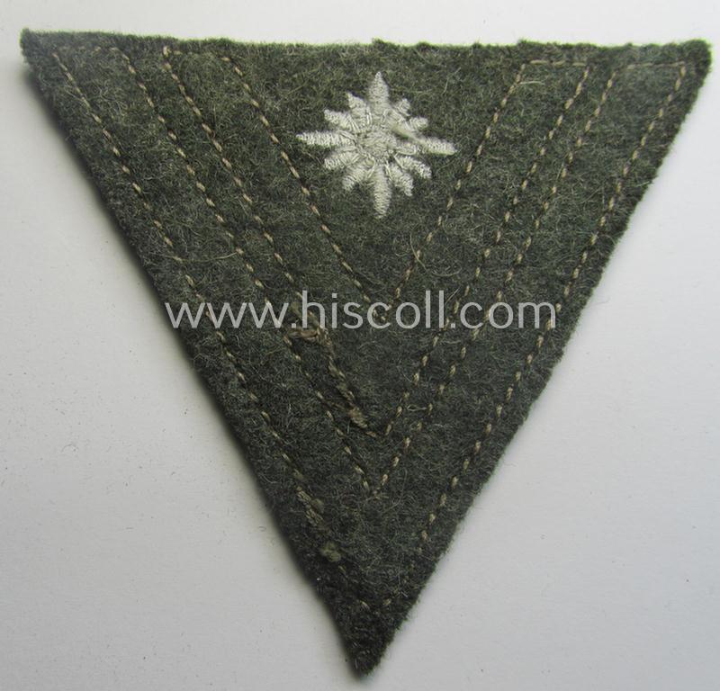 WH (Heeres) 'Armwinkel' (or: arm-chevron) as executed on typical field-grey-coloured wool as was specifically intended for usage by a soldier with the (unusually encountered!) rank of: 'Stabsgefreiter'