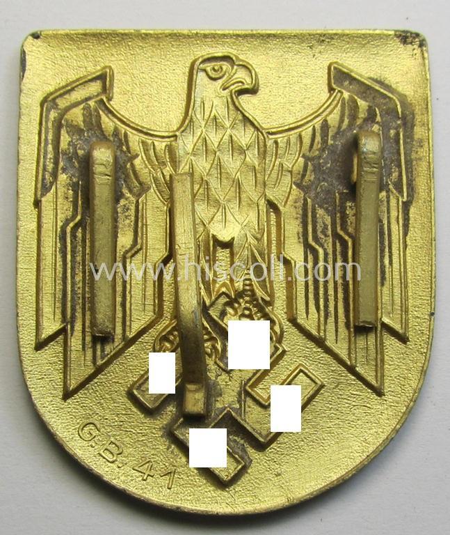 Superb, WH (KM) tropical- (ie. 'DAK'- or: 'Deutsches Afrikakorps'-) related- and/or zinc-based, eagle-'pith-helmet'-shield being a maker- (ie. 'G.B.-41'-) marked example that comes in a very nice- (ie. 'virtually mint- ie. unissued'-), cond...