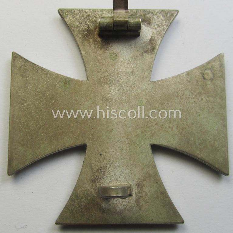 'Eisernes Kreuz 1. Klasse' (ie. Iron Cross 1st class) being an (I deem) mid-war-period produced, neatly maker- (ie. '20'-marked thus by the maker: 'C.F. Zimmermann'-produced) example