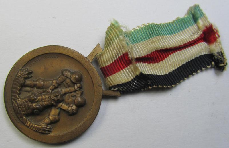 Superb, golden-bronze-coloured- (and I deem 'Buntmetall'-based-) example of a: 'Deutsch-Italienische Feldzugsmedaille' (or: German-Italian campaign medal) that comes mounted on its (regular-sized-) piece of original ribbon