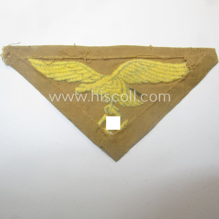 Truly used- and/or carefully shirt-removed, WH (Luftwaffe) 'tropical'-issued breasteagle as was intended for usage onto the tropical-shirts and that show a period ink-text of an US-soldier who liberated this piece as a 'war-souvenir'