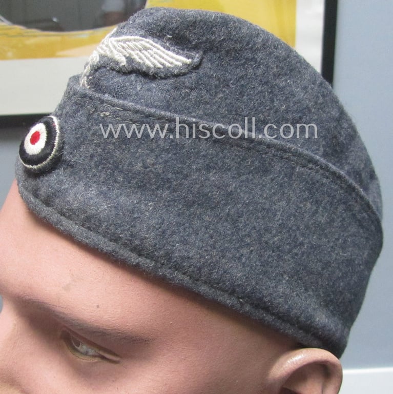 Attractive - albeit moderately used- ie. worn - WH (Luftwaffe) bluish-grey-coloured, EM- (ie. NCO-) type side-cap (ie. 'Schiffchenmütze für Mannschaften u. Unteroffiziere der Luftwaffe')