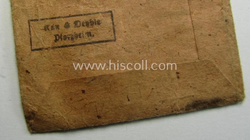 'Luftschutz-Ehrenzeichen 2. Stufe' being a non-maker-marked example, as executed in zinc-based metal (ie. 'Feinzink') and that comes stored in its (scarcely seen!) 'Zellstoff'-based pouch by the maker: 'Katz u. Deyhle'