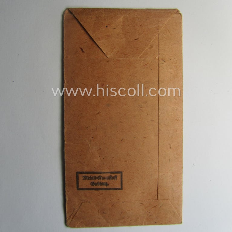 Empty 'Zellstoff'-based pouch as was intended for a medal: 'Winterschlacht im Osten 1941/42' as was produced by the company: 'Metall-Kunststoff - Gablonz'