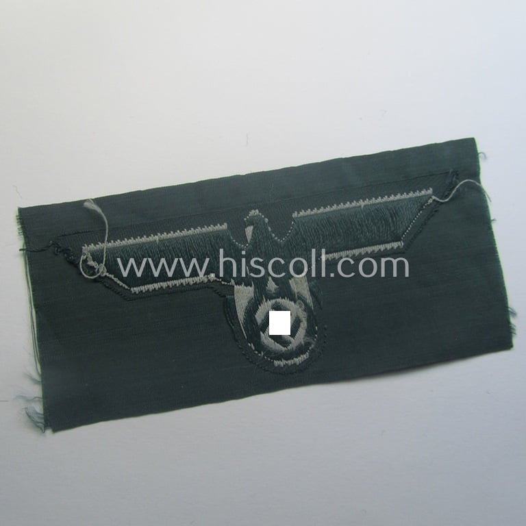 WH (Heeres) early- (ie. pre-war-) period- and/or greyish-coloured breast-eagle of the: 'M36'- (ie. 'M40'-) pattern as was executed in the 'BeVo'-weave pattern on a darker-green-coloured background