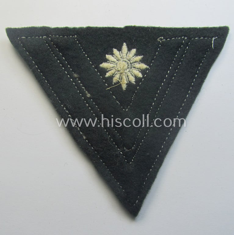 WH (Heeres) 'Armwinkel' (or: arm-chevron) as executed on typical darker-green-coloured wool as was specifically intended for usage by a soldier with the (unusually encountered!) rank of: 'Stabsgefreiter'