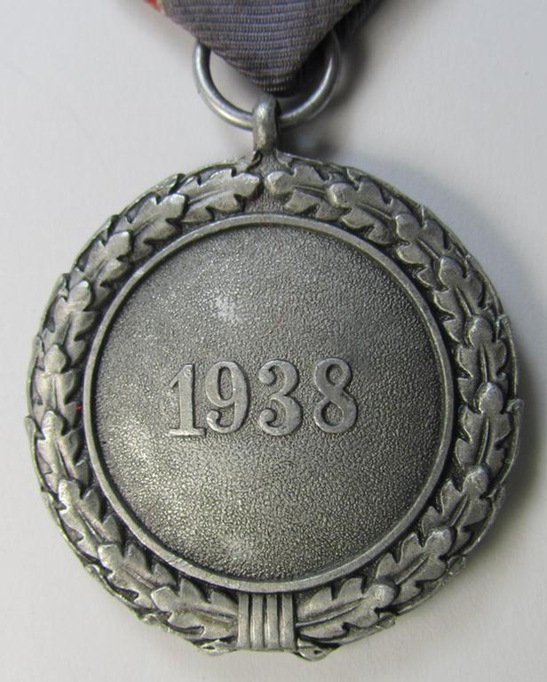 Neat, 'Luftschutz-Ehrenzeichen 2. Stufe' being a non-maker-marked example, as executed in (heavy) zinc-based metal (ie. 'Feinzink') and that comes mounted onto its period ribbon ie. 'Bandabschnitt'
