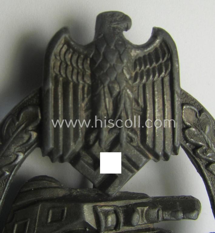 'Panzerkampf-Abzeichen in Bronze' being a 'hollow-back', non-maker-marked- (and/or: zinc- ie. 'Feinzink'-) based example as was procuced by the: 'C.E. Juncker'-company