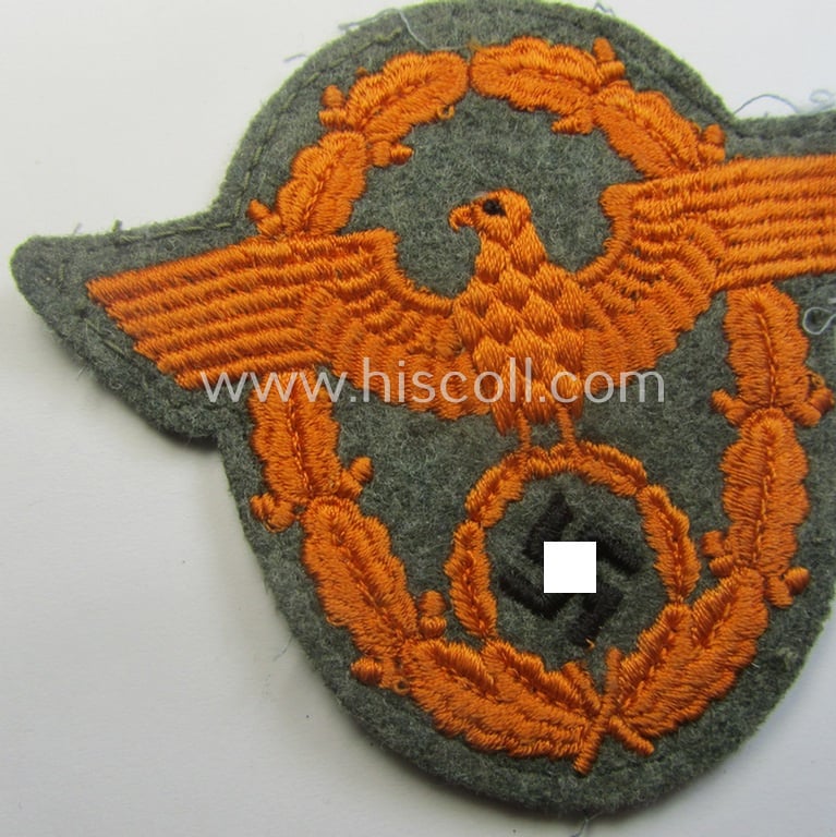 Field-police- (ie. WH-Heeres) related-) arm-eagle (ie. 'Ärmeladler') as was intended for usage by the staff of the notorious 'Feldgendarmerie-Trpn.'