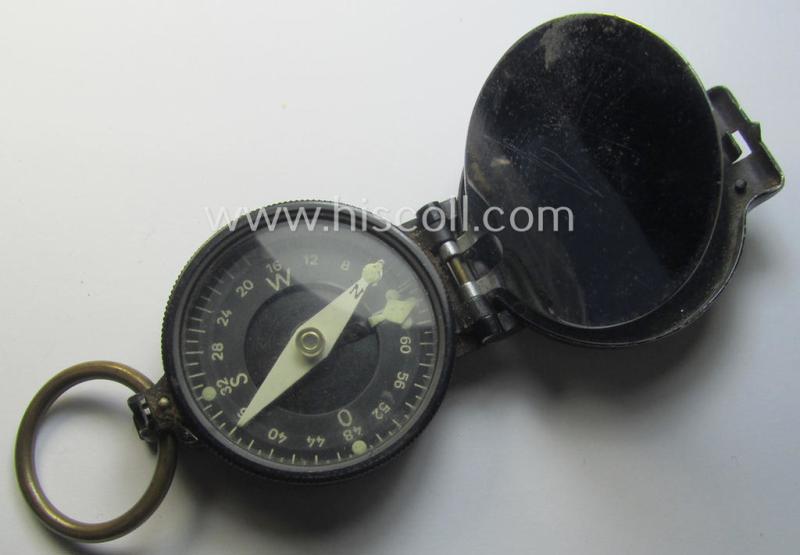 'Standard-issue'-pattern, black-coloured and/or copper-based WH-compass (ie. 'Marschkompass') which is nicely 'MK'-marked and/or individually numbered: '45817' and that came mounted onto its period 'Fangschnur'