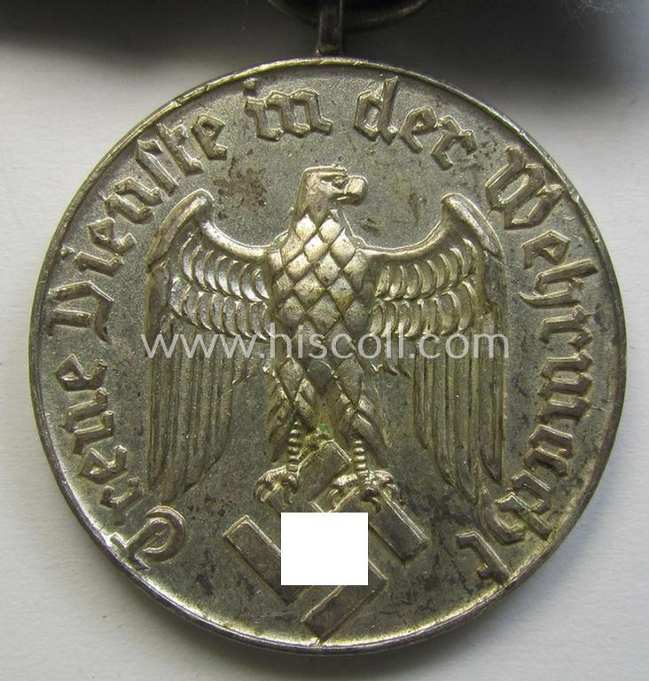 Attractive, bright silver-toned WH (Luftwaffe) so-called: 'Einzelspange' showing a: 'WH-Dienstauszeichnung 4. Stufe' (as was intended for 4 years of loyal-service) and that shows a detailed, Luftwaffe-type-eagle-device, period-attached