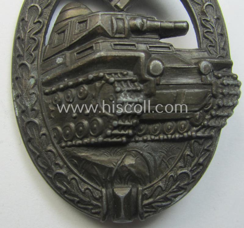 'Panzerkampfabzeichen in Bronze' (or: bronze-class panzer-assault badge or PAB) being a clearly maker- (ie. 'AS' in a triangle-) marked- and/or typical zinc- (ie. 'Feinzink'-) based specimen as was procuced by a to date unknown maker