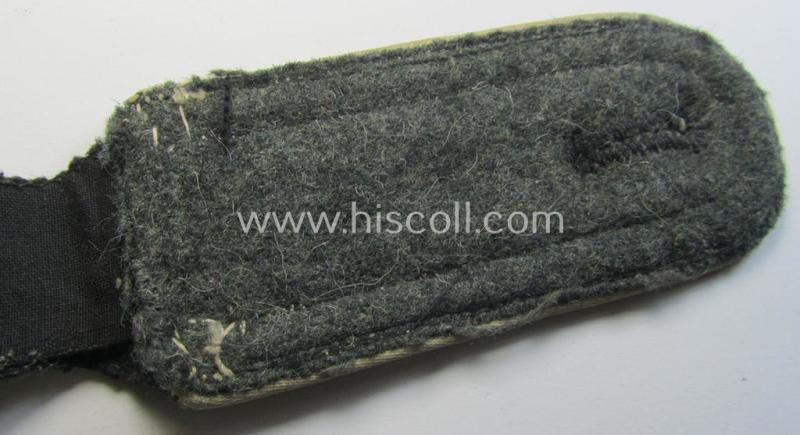 Superb - albeit regrettably single! - Waffen-SS NCO-type shoulderstrap as piped in the white-coloured branchcolour as was intended for usage by an: 'SS-Unterscharführer' who served within the: 'Waffen-SS Infanterie-Truppen'
