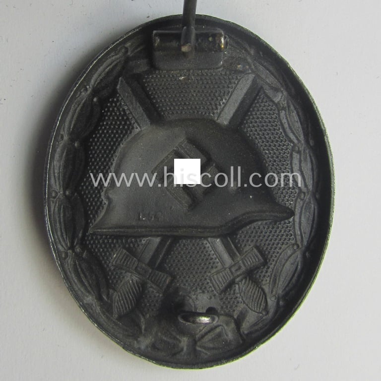 Neatly maker- (ie. 'L/54'-) marked example of a black-class wound-badge (or: 'Verwundeten-Abzeichen in Schwarz') being an example that was produced by the maker (ie. 'Hersteller') named: 'Schauerte u. Höhfeld'