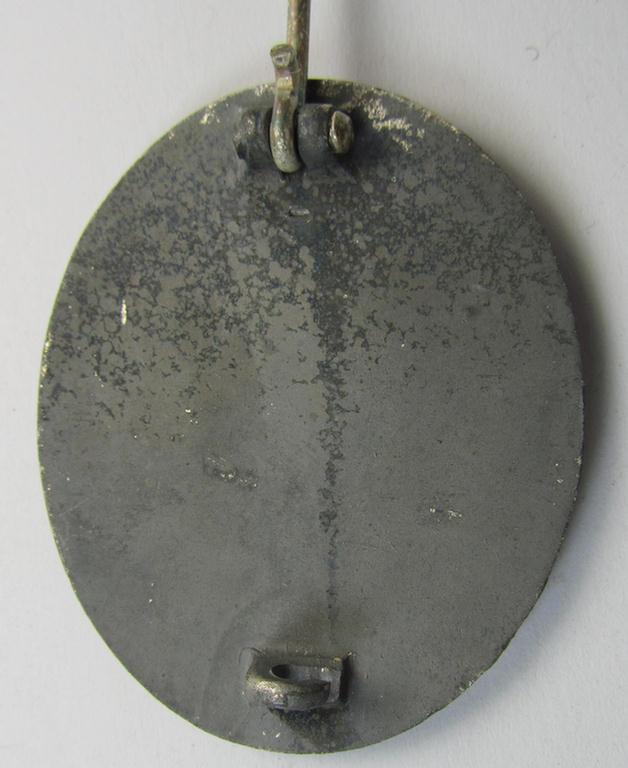 Moderately used, non-maker-marked example of a silver-class wound-badge (or: 'Verwundeten-Abzeichen in Silver') being a typical zinc- (ie. 'Feinzink'-) based example