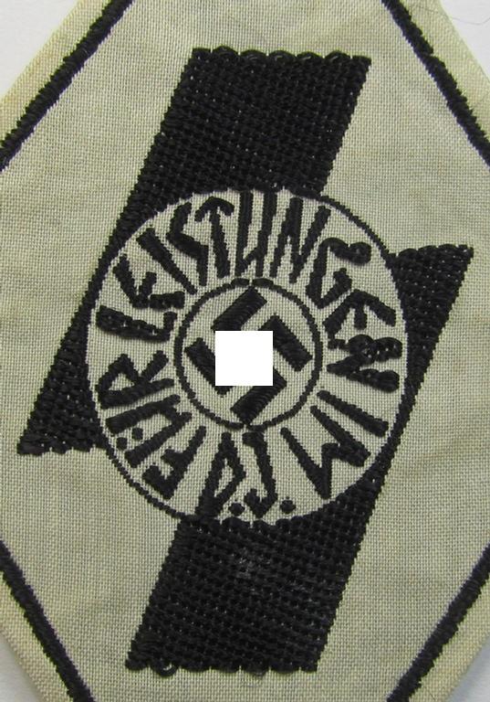 Superb - and rarely found! - DJ- (ie. 'Deutsches Jungvolk'-) so-called: 'Leistungsabzeichen in Schwarz' (or: black-class youth sports'-badge) being a cloth-based version as executed in the neat: 'BeVo'-weave pattern