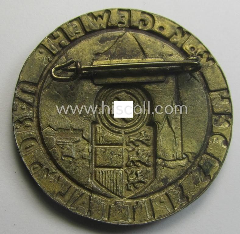 Unsual, golden-toned- and partly enamelled: 'Veranstaltungsabzeichen des Standschützenverbandes Tirol-Vorarlberg' depicting the text: 'K.K. Gewehr - Kreis Spittal a.d. Drau'