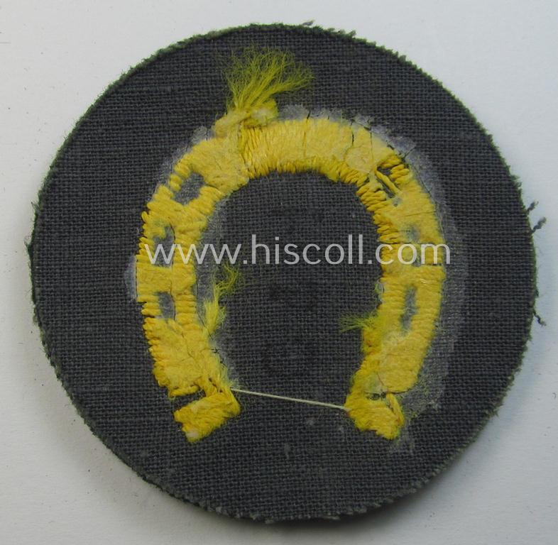 WH (Heeres) so-called: trade- and/or special-career arm-insignia (ie. 'Laufbahn- o. Tätigkeitsabzeichen') as was specifically intended for an army: 'Hufbeschlagmeister' (or farrier) being a neatly hand-embroidered variant on darker-green-coloured...