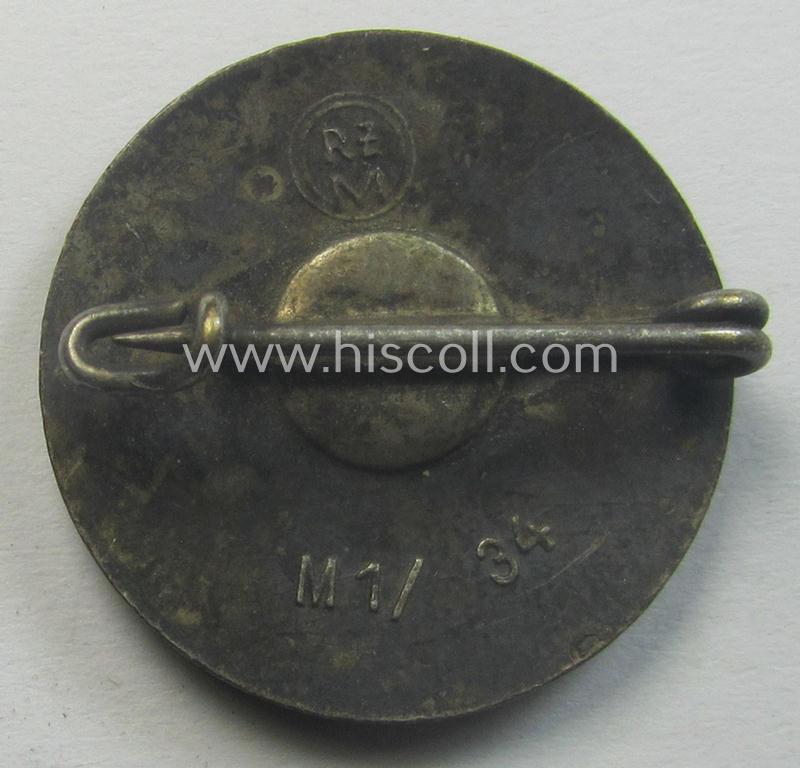 'N.S.D.A.P.'-membership-pin- ie. party-badge (or: 'Parteiabzeichen') which is maker-marked on its back with the makers'-designation: 'RzM' and/or: 'M1/34'