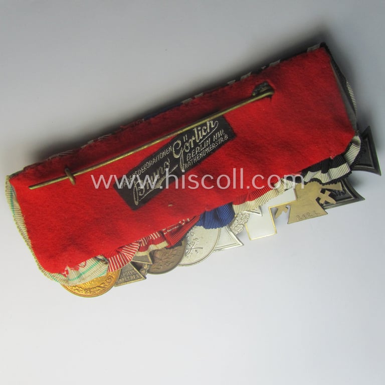 Superb, 8-pieced WWI- (ie. TR-) related medal-bar (ie. 'Ordenspange') depicting an: 'EKII.Kl., an: 'FKK 1914-18 mit S.', an: 'EZ für D. Vp 3. Stf.', a: 'TD-Ez. der 2. Kl.', a: 'Deu. Olympia-E.medaille 1936' and three Austrian WWI-period comm. medals