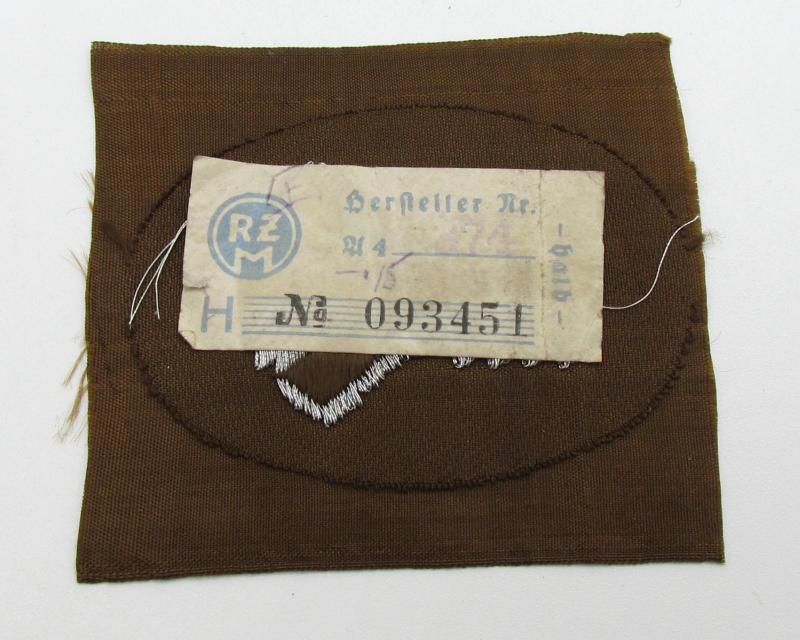 SA- ('Sturmabteilungen'-) related armbadge ( 'Ärmelabzeichen für Führer') with RZM Label