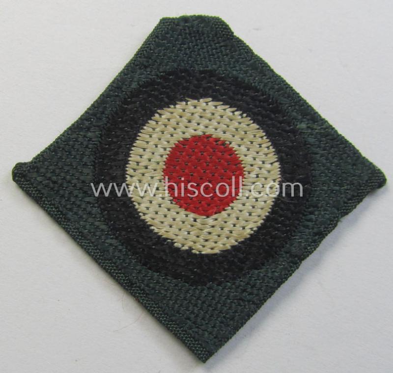 Pre- (ie. early-) war-period, WH (Heeres) cap-eagle & cocarde-set (ie. 'Schiffchenmützen-Adler u. Kokarde für Mannschaften u. Uffz.') being a cap-removed set as executed in bluish-grey-coloured linnen on a darker-green-coloured background