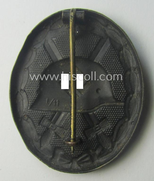 Clearly maker- (ie. 'L/11'-) marked example of a black-class wound-badge (or: 'Verwundeten-Abzeichen in Schwarz') being an example that was produced by the maker (ie. 'Hersteller') named: 'Wilhelm Deumer'