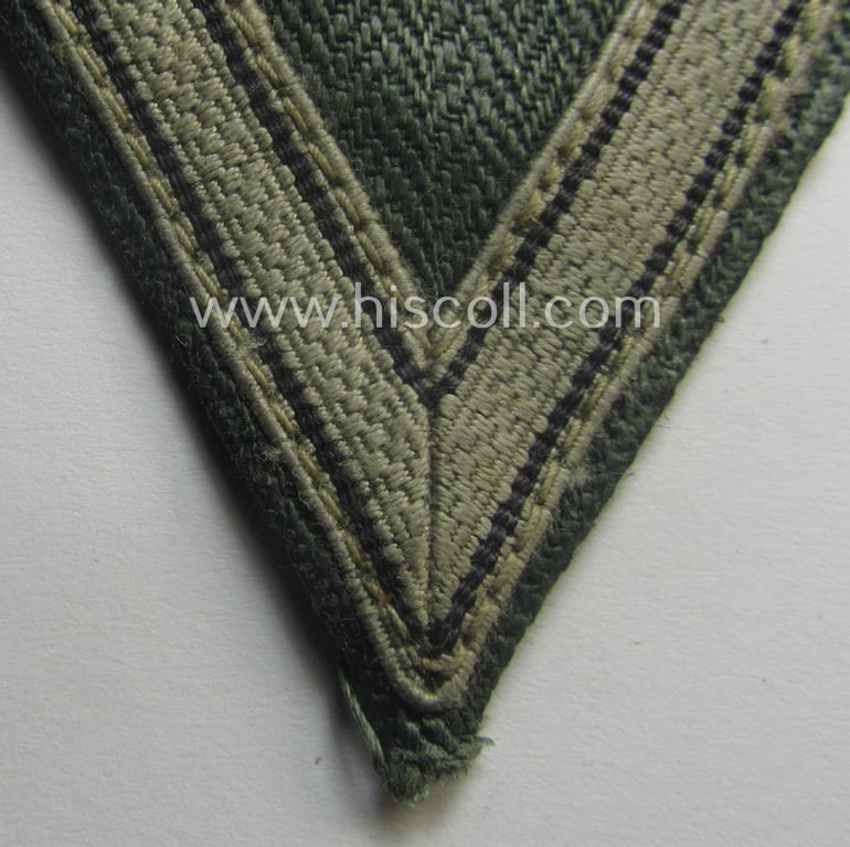 WH (Heeres ie. Waffen-SS) 'Armwinkel' (or: arm-chevron) as was executed on a greenish-coloured- and/or 'HBT'-like (ie. 'Drillich'-) based background as was specifically intended for a: 'Gefreiter' (ie. 'SS-Sturmmann')